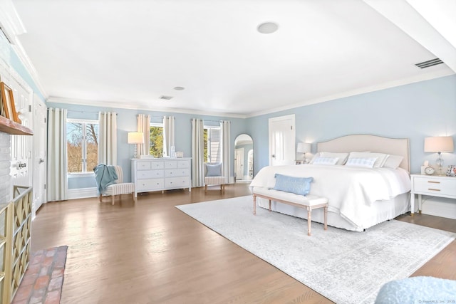 47 Peaceable St, Ridgefield, CT 06877 - bedroom featuring arched walkways, wood finished floors, and ornamental molding