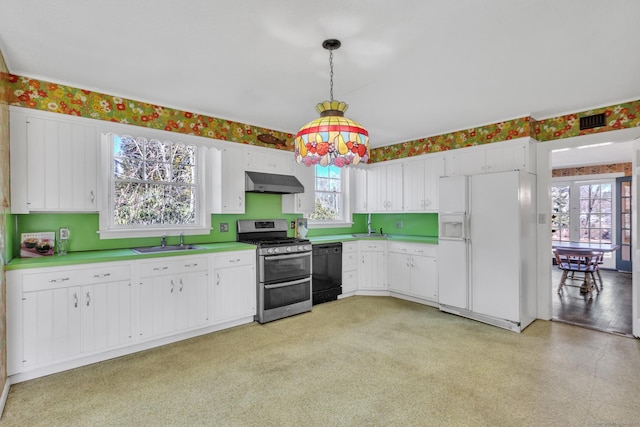 kitchen featuring under cabinet range hood, dishwasher, a sink, double oven range, and white refrigerator with ice dispenser