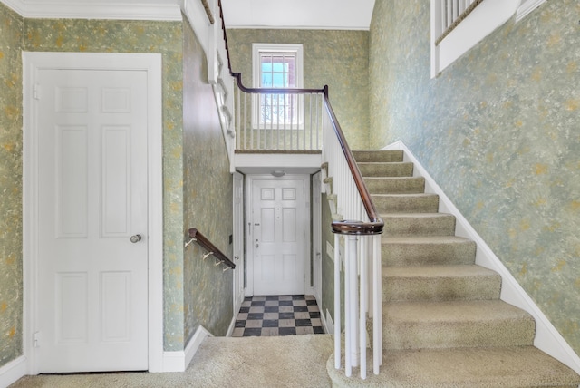 stairs with wallpapered walls, baseboards, and tile patterned floors