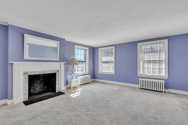 unfurnished living room featuring baseboards, radiator heating unit, and carpet