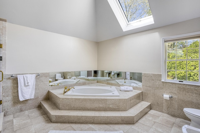 21 Centennial Dr, Danbury, CT 06811 - bathroom featuring toilet, a skylight, tile walls, and a bath