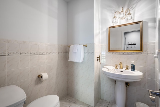 21 Centennial Dr, Danbury, CT 06811 - half bathroom featuring toilet, tile walls, and wainscoting