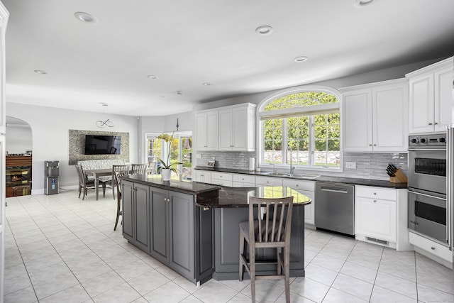 21 Centennial Dr, Danbury, CT 06811 - kitchen featuring a sink, white cabinetry, appliances with stainless steel finishes, and a kitchen island