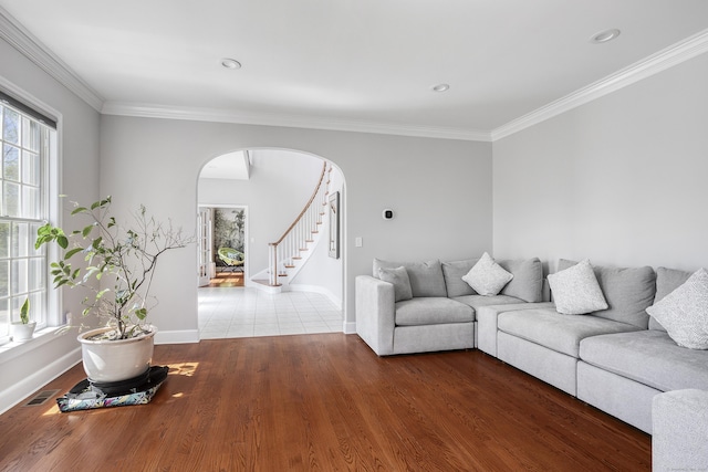 21 Centennial Dr, Danbury, CT 06811 - living area featuring arched walkways, baseboards, visible vents, and ornamental molding