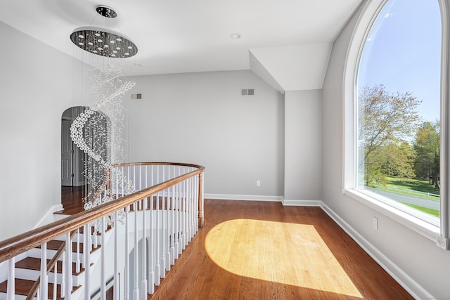 21 Centennial Dr, Danbury, CT 06811 - hall featuring baseboards, vaulted ceiling, wood finished floors, and visible vents