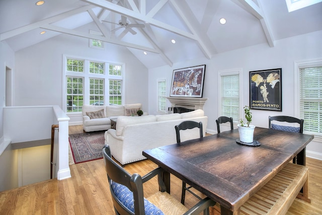 dining space with beam ceiling, a ceiling fan, recessed lighting, and light wood-style floors