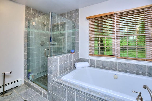full bath with tile patterned floors, a shower stall, a baseboard heating unit, and a garden tub