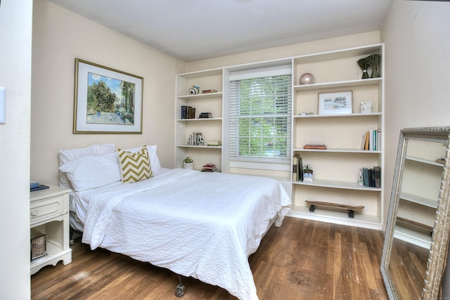 bedroom with wood finished floors