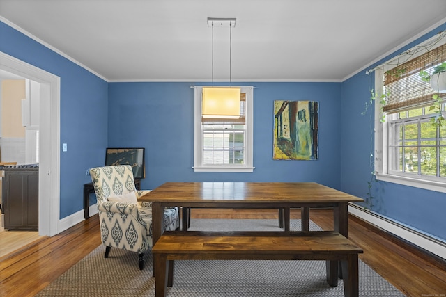 498 Whitney Ave Unit 1D, New Haven, CT 06511 - dining area with wood finished floors, baseboard heating, ornamental molding, and baseboards