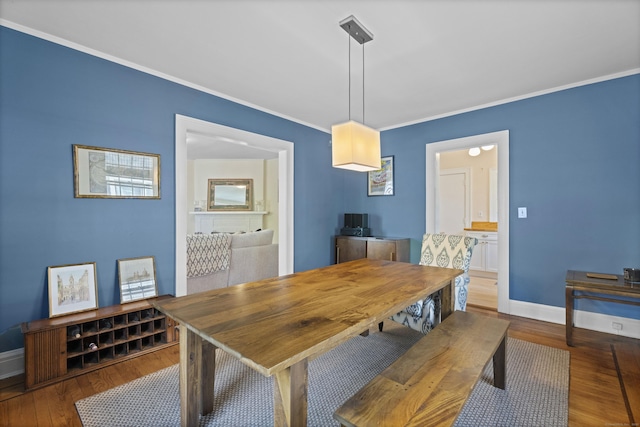 498 Whitney Ave Unit 1D, New Haven, CT 06511 - dining area with baseboards, wood finished floors, and ornamental molding