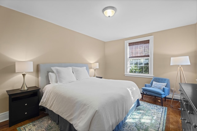 498 Whitney Ave Unit 1D, New Haven, CT 06511 - bedroom with a baseboard radiator, dark wood-style flooring, and baseboards