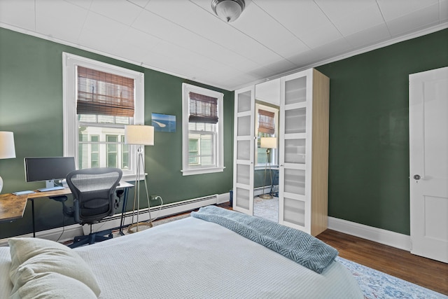 498 Whitney Ave Unit 1D, New Haven, CT 06511 - bedroom featuring wood finished floors, a baseboard radiator, baseboards, and a desk