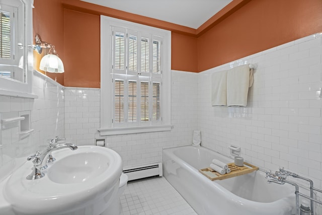 498 Whitney Ave Unit 1D, New Haven, CT 06511 - full bath featuring a baseboard heating unit, tile walls, tile patterned flooring, a garden tub, and wainscoting