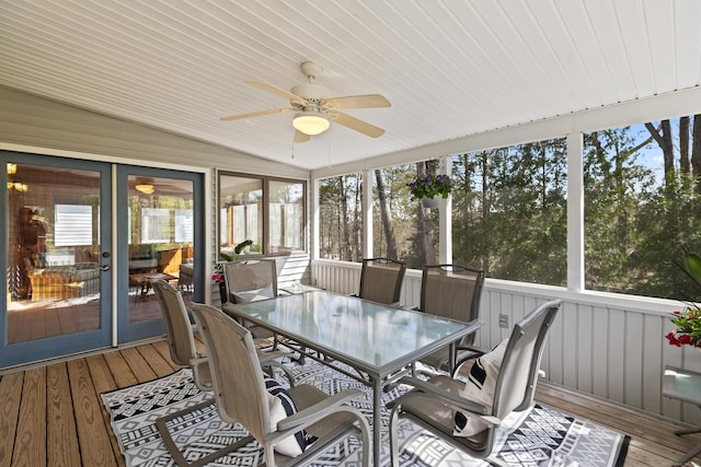 sunroom featuring ceiling fan and outdoor dining area