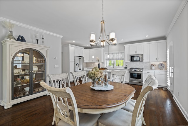 dining space with crown molding, dark wood-style flooring, a notable chandelier, and recessed lighting