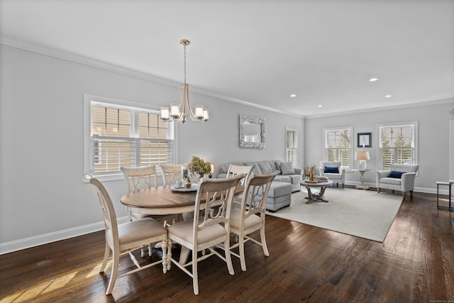 dining room featuring crown molding, baseboards, an inviting chandelier, and dark wood finished floors