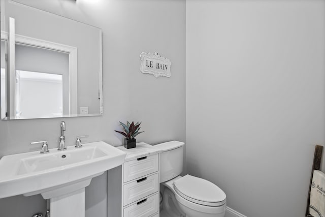 bathroom with a sink and toilet