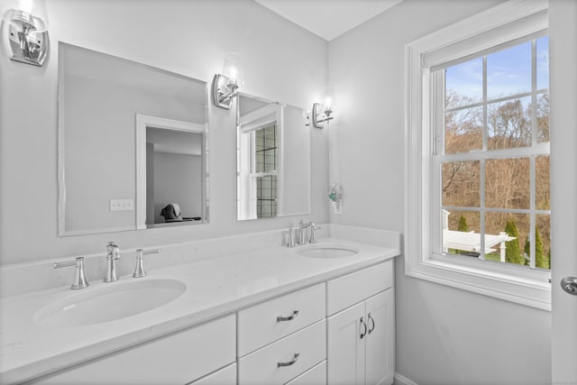 full bath featuring double vanity and a sink