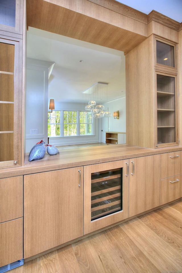 7 Brookside Dr, Westport, CT 06880 - bar featuring a chandelier, light wood finished floors, and wine cooler