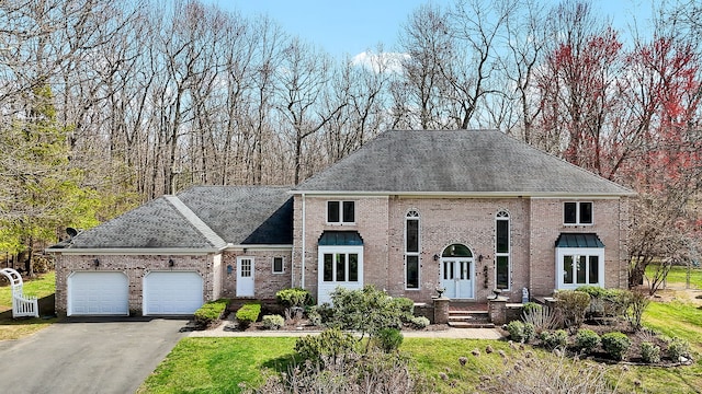 17 Hidden Oak Dr, Farmington, CT 06032 - view of front of property with an attached garage, driveway, brick siding, and a shingled roof
