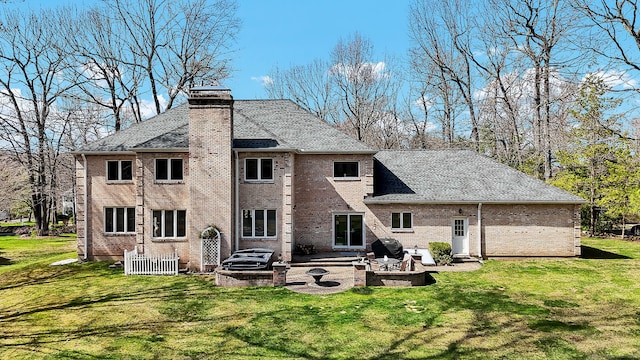 17 Hidden Oak Dr, Farmington, CT 06032 - rear view of house with a patio, a yard, a chimney, and brick siding