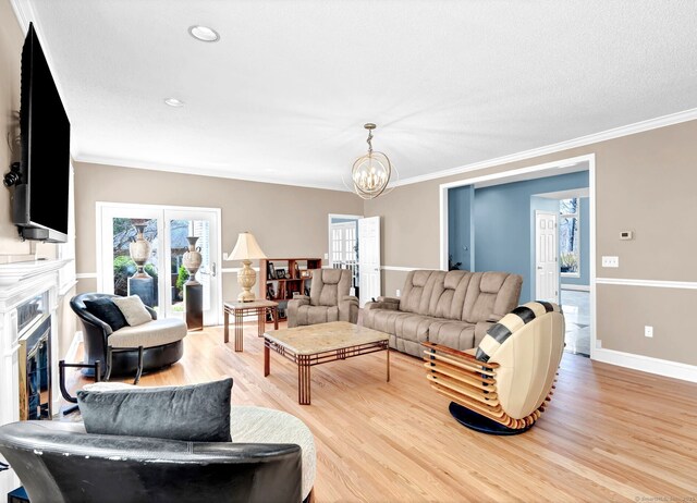 17 Hidden Oak Dr, Farmington, CT 06032 - living room featuring light wood-style floors, a fireplace, healthy amount of natural light, crown molding, and recessed lighting