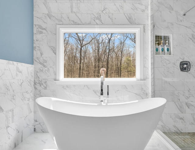 17 Hidden Oak Dr, Farmington, CT 06032 - full bath with healthy amount of natural light, a freestanding tub, marble finish flooring, and tile walls