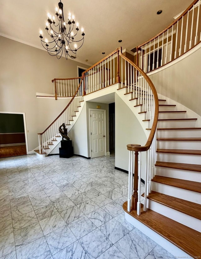 17 Hidden Oak Dr, Farmington, CT 06032 - staircase featuring marble finish flooring, a chandelier, a towering ceiling, and recessed lighting