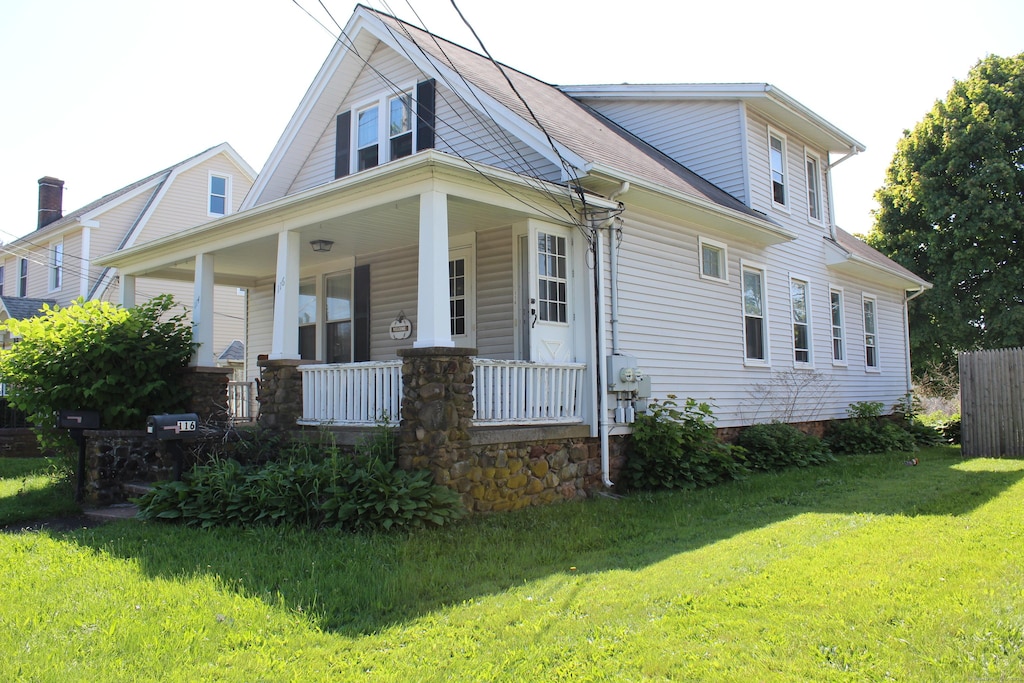 114-116 Hemingway Ave, East Haven, CT 06512 - view of front of property with covered porch and a front lawn