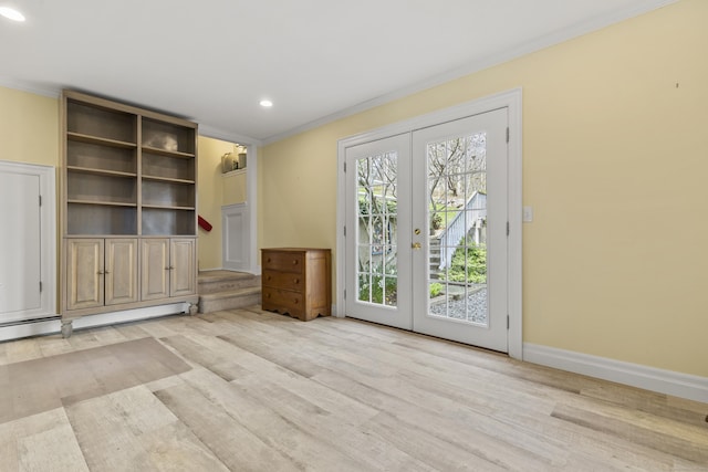 unfurnished living room with french doors, wood finished floors, recessed lighting, and crown molding