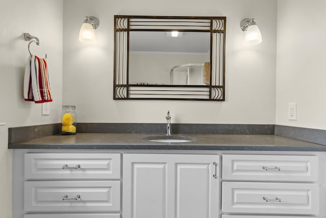 bathroom featuring vanity and crown molding