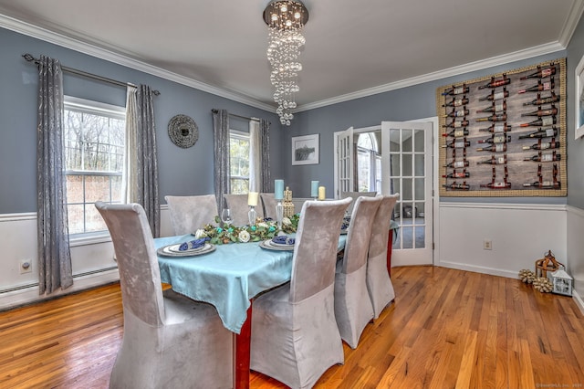 340 Webb Cir, Monroe, CT 06468 - dining space featuring a chandelier, wood finished floors, baseboards, and ornamental molding