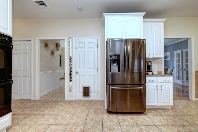 340 Webb Cir, Monroe, CT 06468 - kitchen featuring stainless steel fridge with ice dispenser, white cabinetry, light tile patterned flooring, and visible vents
