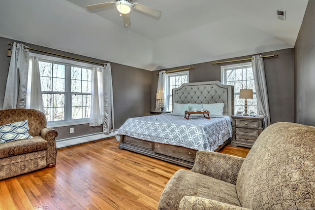 340 Webb Cir, Monroe, CT 06468 - bedroom with vaulted ceiling, wood finished floors, visible vents, a baseboard radiator, and ceiling fan