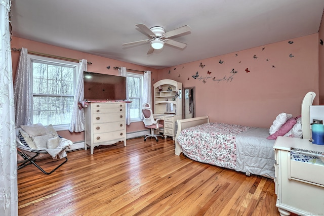 340 Webb Cir, Monroe, CT 06468 - bedroom featuring light wood finished floors, a baseboard heating unit, and ceiling fan