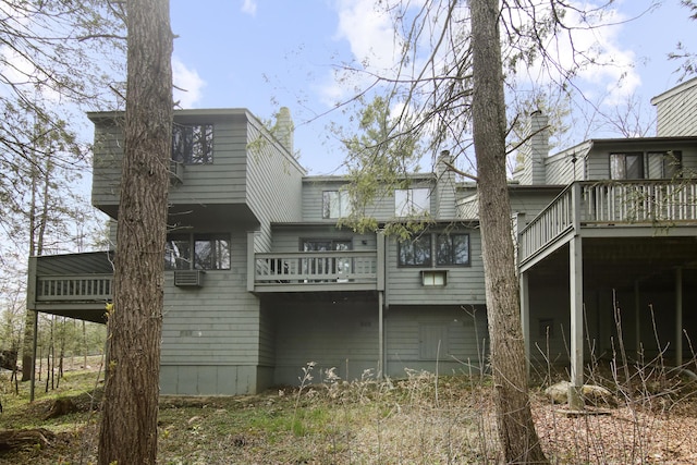 rear view of property with a deck