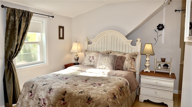 bedroom with lofted ceiling