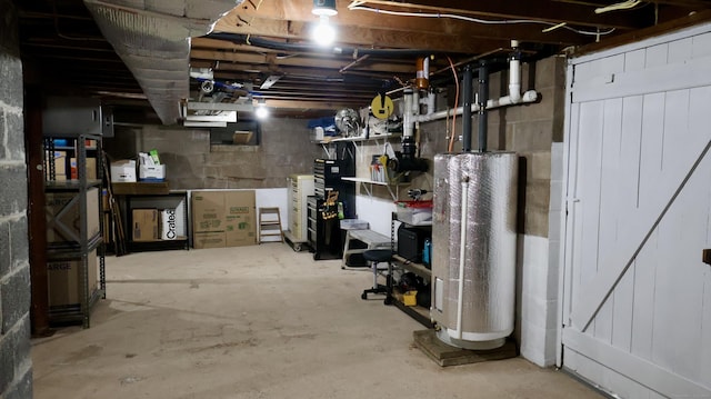 unfinished below grade area with water heater and concrete block wall