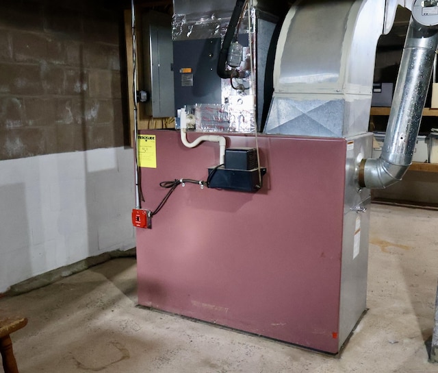 utility room featuring heating unit