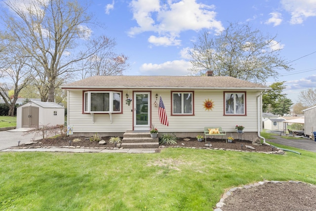 98 Cynthia Dr, West Haven, CT 06516 - view of front of house featuring a front yard, an outbuilding, a chimney, a shed, and roof with shingles