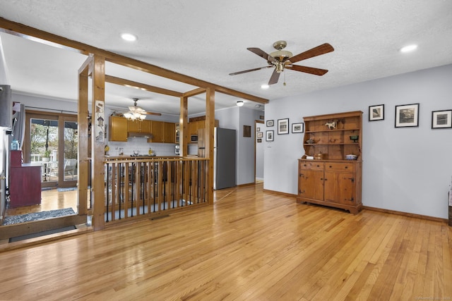 98 Cynthia Dr, West Haven, CT 06516 - living room with light wood finished floors, a textured ceiling, ceiling fan, and baseboards