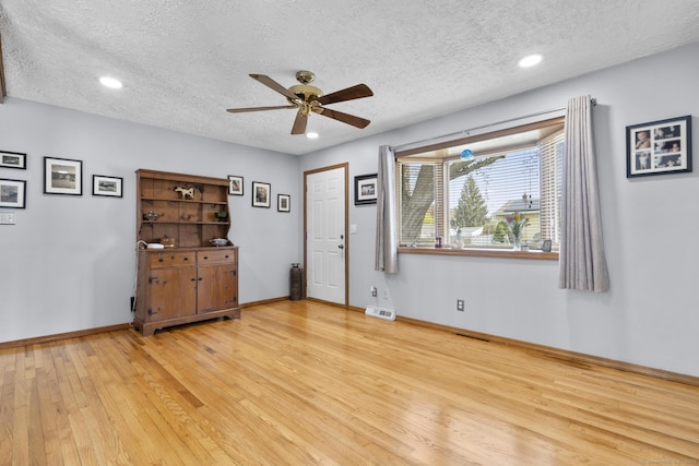 98 Cynthia Dr, West Haven, CT 06516 - unfurnished room with a ceiling fan, visible vents, a textured ceiling, and light wood-style floors