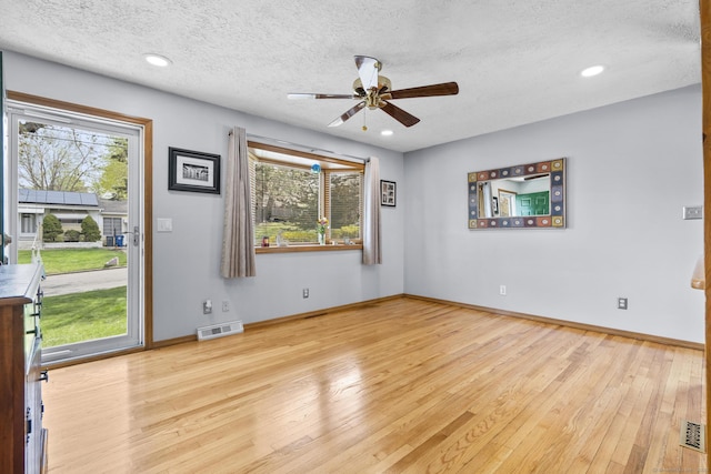 98 Cynthia Dr, West Haven, CT 06516 - spare room featuring visible vents, a healthy amount of sunlight, ceiling fan, and wood-type flooring