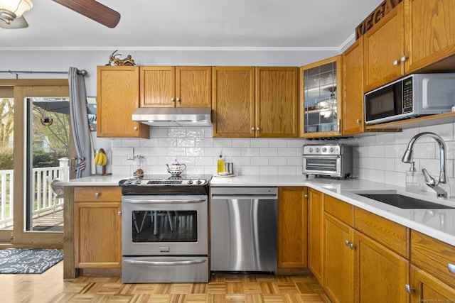 98 Cynthia Dr, West Haven, CT 06516 - kitchen with appliances with stainless steel finishes, a sink, light countertops, and under cabinet range hood