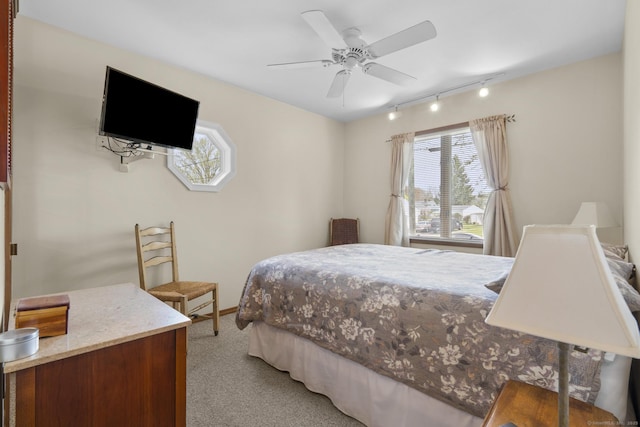 98 Cynthia Dr, West Haven, CT 06516 - bedroom featuring a ceiling fan, track lighting, light colored carpet, and baseboards