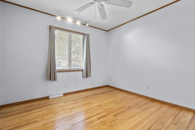 98 Cynthia Dr, West Haven, CT 06516 - empty room with crown molding, a ceiling fan, track lighting, visible vents, and hardwood / wood-style flooring