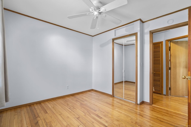 98 Cynthia Dr, West Haven, CT 06516 - unfurnished bedroom with light wood finished floors, a closet, a ceiling fan, baseboards, and ornamental molding