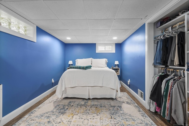 98 Cynthia Dr, West Haven, CT 06516 - bedroom with baseboards, visible vents, wood finished floors, and a drop ceiling