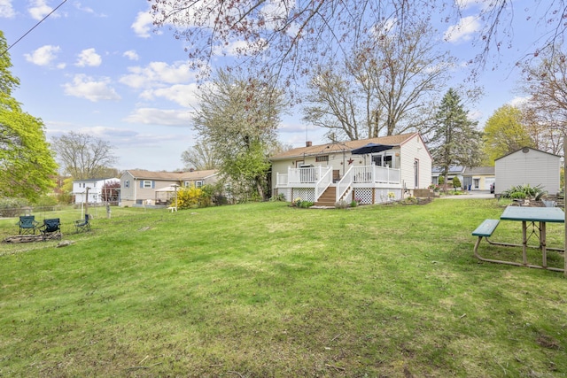 98 Cynthia Dr, West Haven, CT 06516 - back of property featuring fence, a yard, stairs, and a wooden deck
