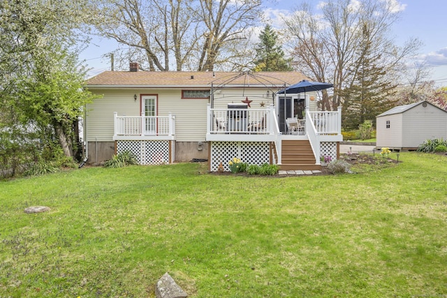 98 Cynthia Dr, West Haven, CT 06516 - rear view of property featuring a deck, an outdoor structure, a chimney, and a lawn